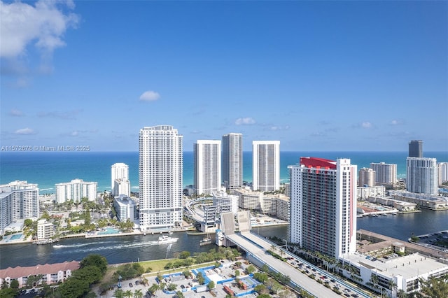 aerial view featuring a view of city and a water view