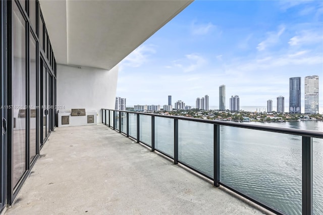 balcony featuring a water view