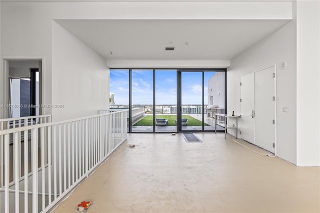 spare room featuring concrete flooring