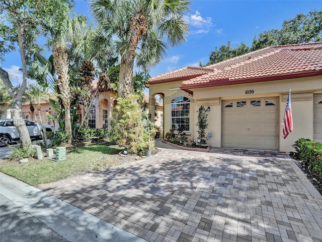 mediterranean / spanish-style house featuring a garage