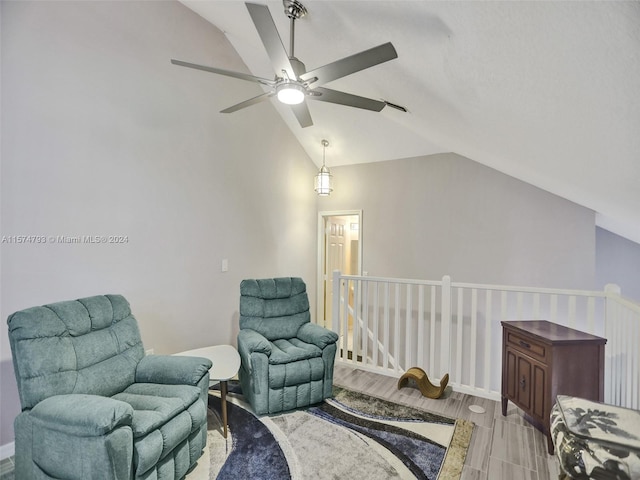 sitting room with ceiling fan, vaulted ceiling, and hardwood / wood-style floors