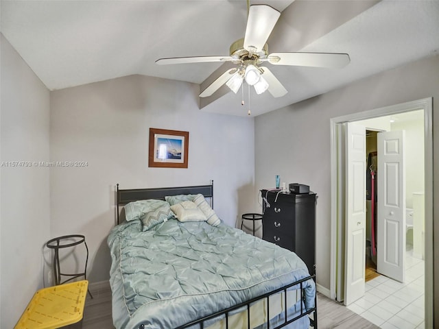 bedroom with tile floors, ceiling fan, and lofted ceiling