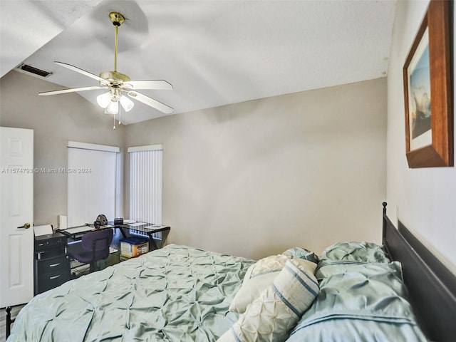 bedroom featuring lofted ceiling and ceiling fan