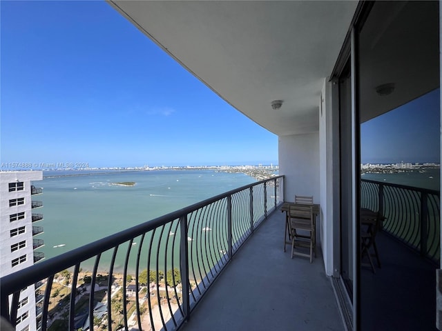 balcony featuring a water view