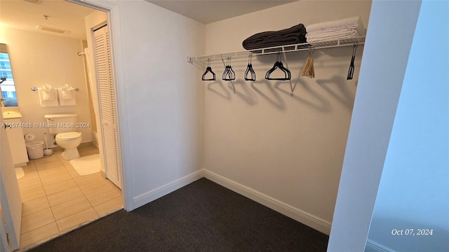 walk in closet featuring light tile patterned floors