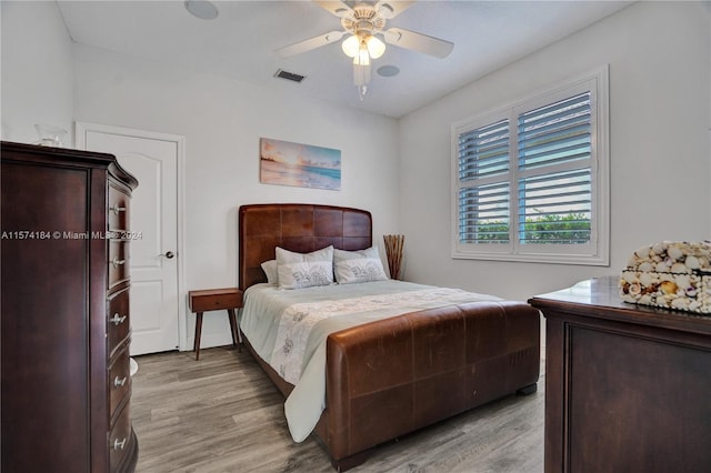 bedroom featuring ceiling fan and light wood-type flooring