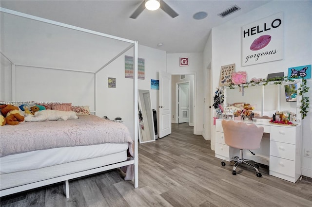 bedroom with ceiling fan and light wood-type flooring