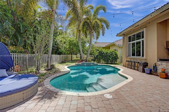 view of pool featuring a patio area