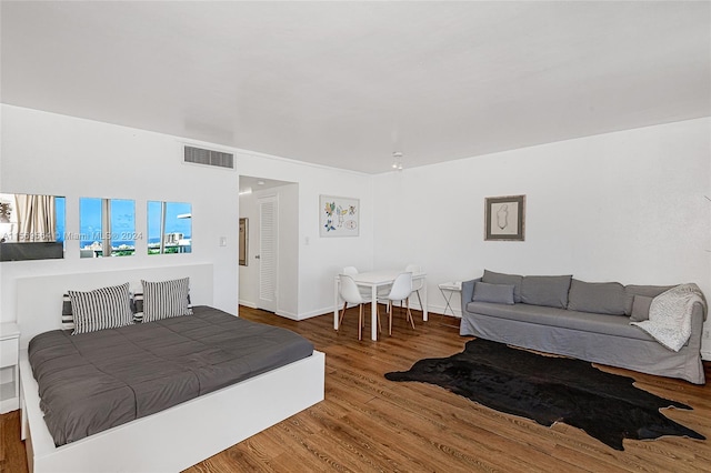 bedroom with wood-type flooring