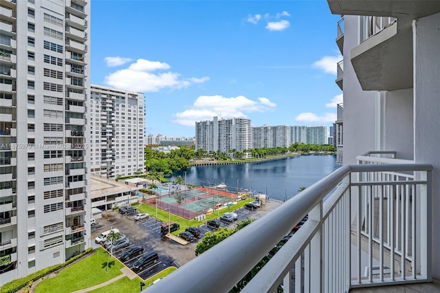 balcony with a view of city and a water view