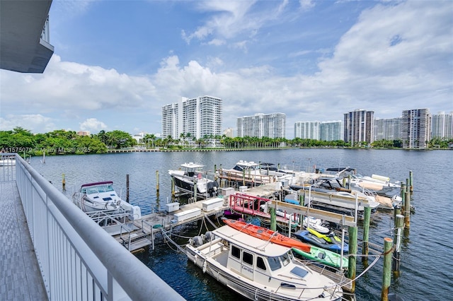 dock area featuring a water view and a view of city