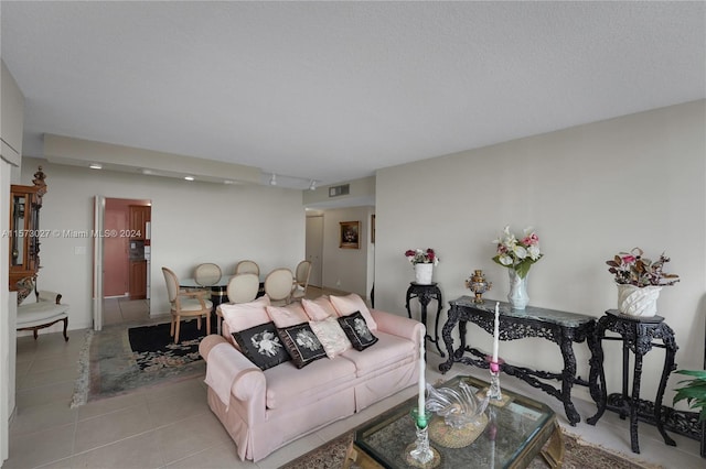 living room with tile flooring