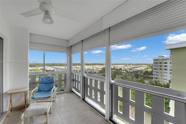 sunroom featuring plenty of natural light and ceiling fan