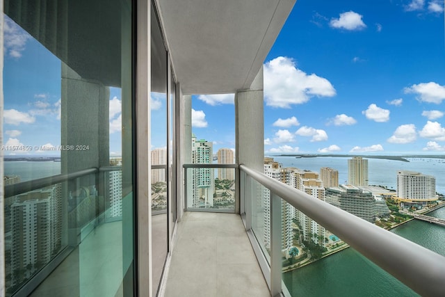 balcony featuring a water view