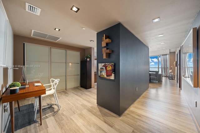 interior space featuring light hardwood / wood-style floors and floor to ceiling windows