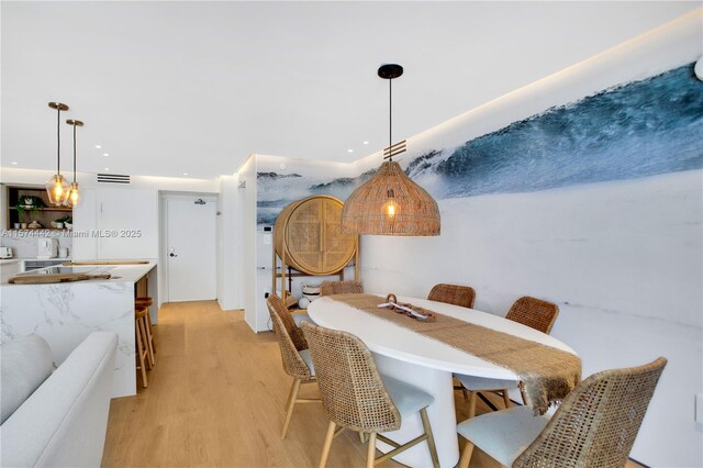 dining space featuring light hardwood / wood-style floors