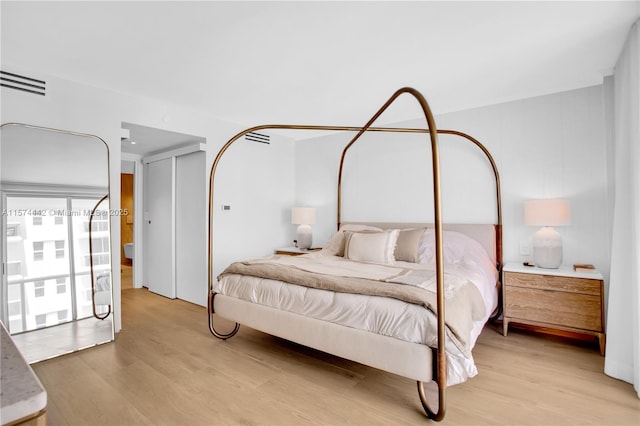 bedroom with light wood-type flooring