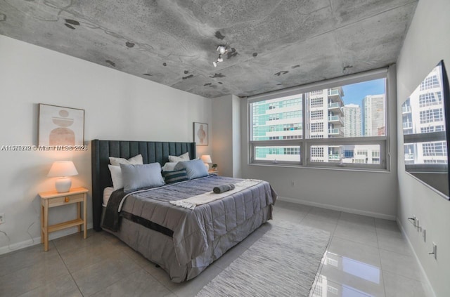 bedroom featuring light tile patterned floors