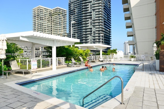 view of pool featuring a patio