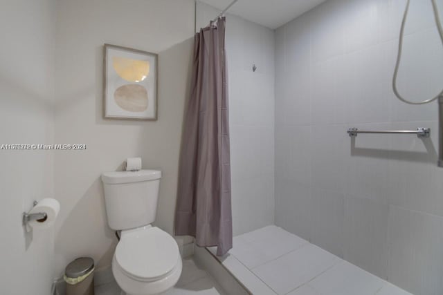 bathroom with toilet and walk in shower