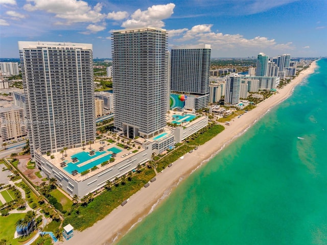 bird's eye view with a view of the beach and a water view