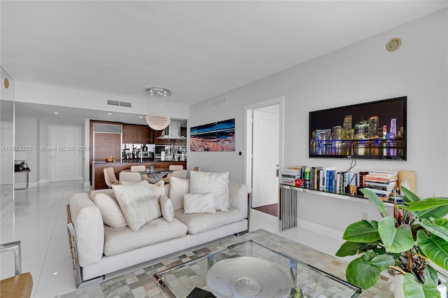 living room featuring light tile floors