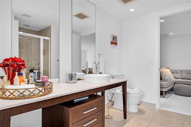 bathroom featuring large vanity, tile floors, and toilet