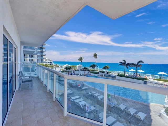 balcony featuring a water view