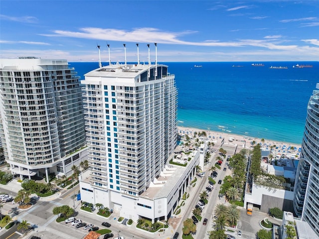 aerial view featuring a water view and a view of the beach