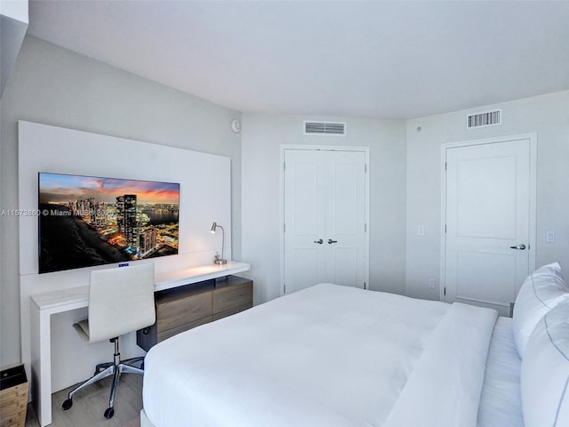 bedroom featuring a closet and light hardwood / wood-style flooring