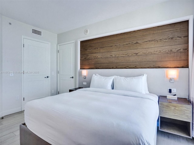 bedroom with light hardwood / wood-style flooring