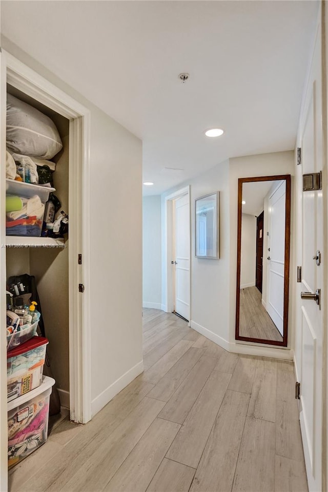 corridor with light wood-type flooring