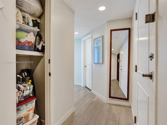 hall with light hardwood / wood-style flooring