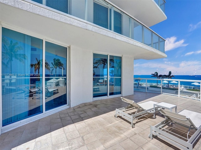 view of patio featuring a water view