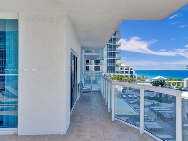 balcony featuring a water view