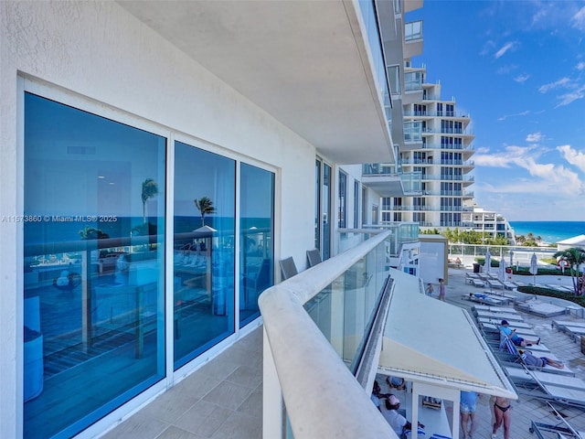 balcony featuring a water view