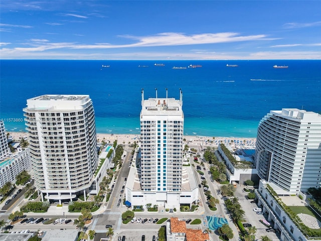 bird's eye view with a view of the beach and a water view