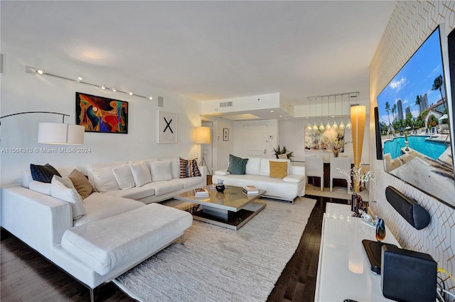 living room with dark hardwood / wood-style floors