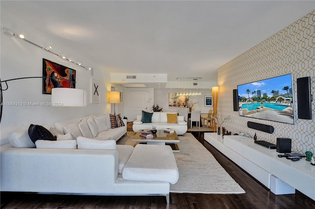 living room with dark hardwood / wood-style flooring