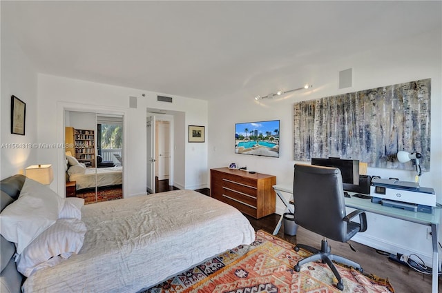 bedroom featuring wood-type flooring