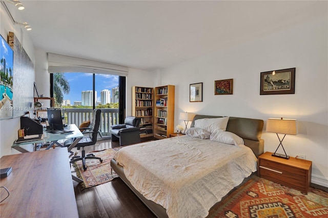 bedroom featuring dark hardwood / wood-style flooring