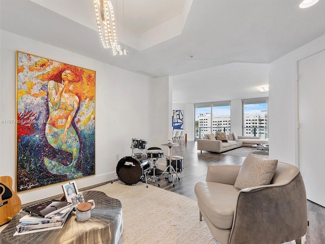 interior space featuring hardwood / wood-style floors and an inviting chandelier