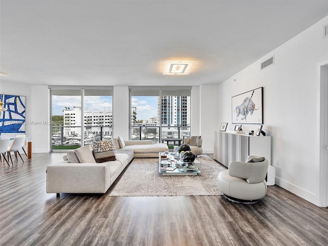 living room featuring hardwood / wood-style floors and floor to ceiling windows