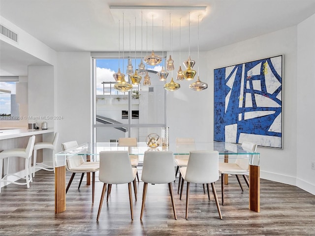 dining area with wood-type flooring