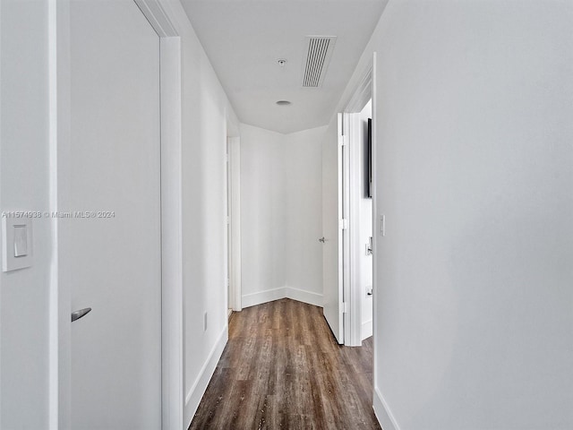 hall with hardwood / wood-style flooring