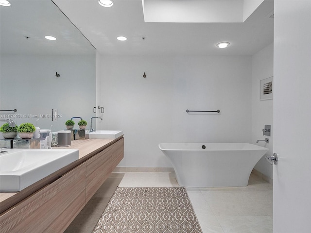 bathroom with dual bowl vanity and tile patterned flooring