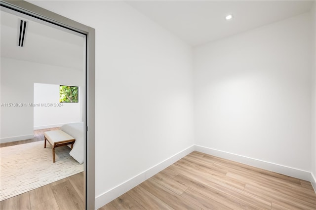 empty room with light hardwood / wood-style floors