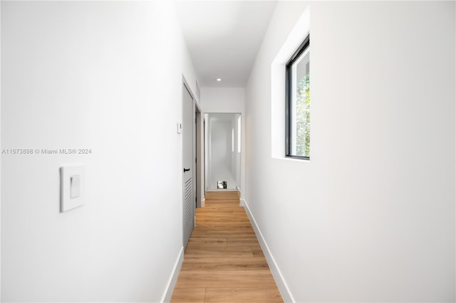 corridor featuring light hardwood / wood-style floors