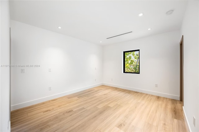 spare room with light hardwood / wood-style floors