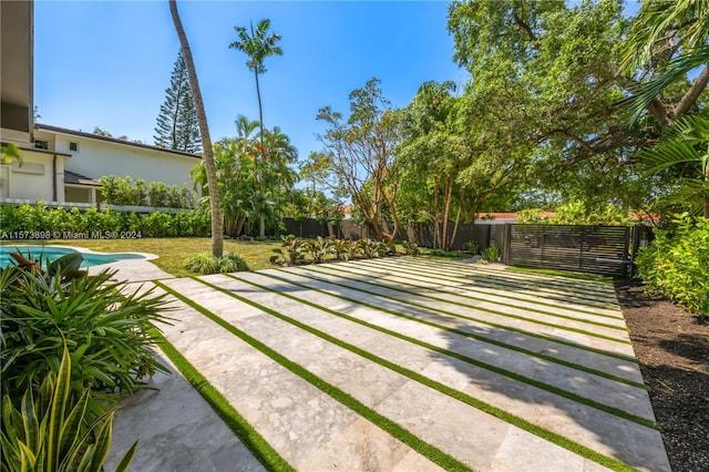 view of yard featuring a fenced in pool